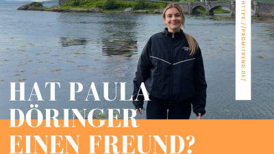 Eine Person steht vor einer Burg am Wasser, mit der Frage "Hat Paula Döringer einen Freund?" im Vordergrund.