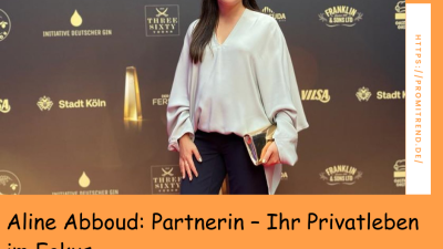 Eine Frau steht auf einem roten Teppich vor einer Sponsorenwand. Der Text auf dem Bild lautet: "Aline Abboud: Partnerin - Ihr Privatleben im Fokus".